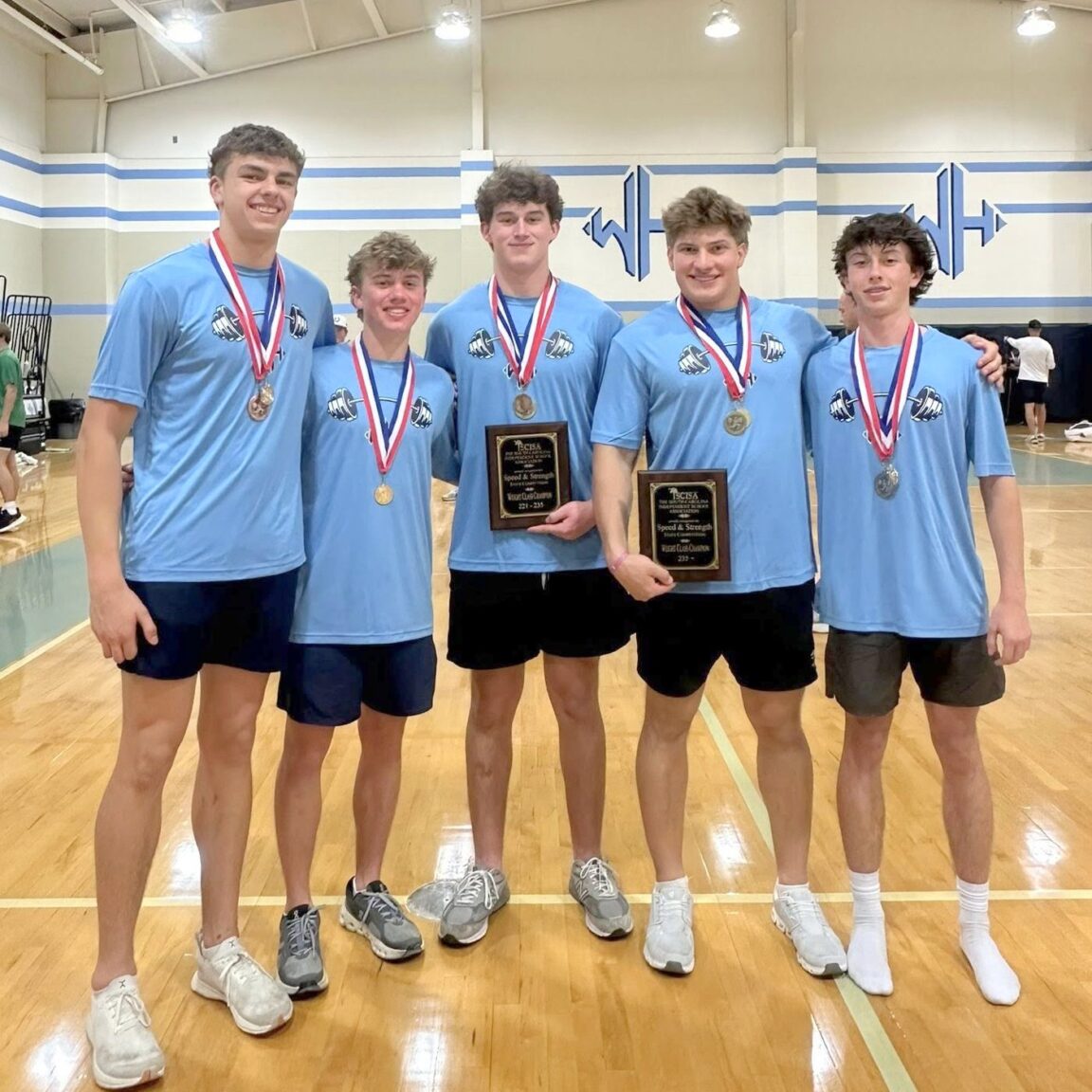 State Champion speed and strength team members with their medals.