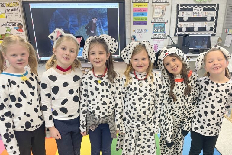 first grade students dressed up in their 101 Dalmatians outfits