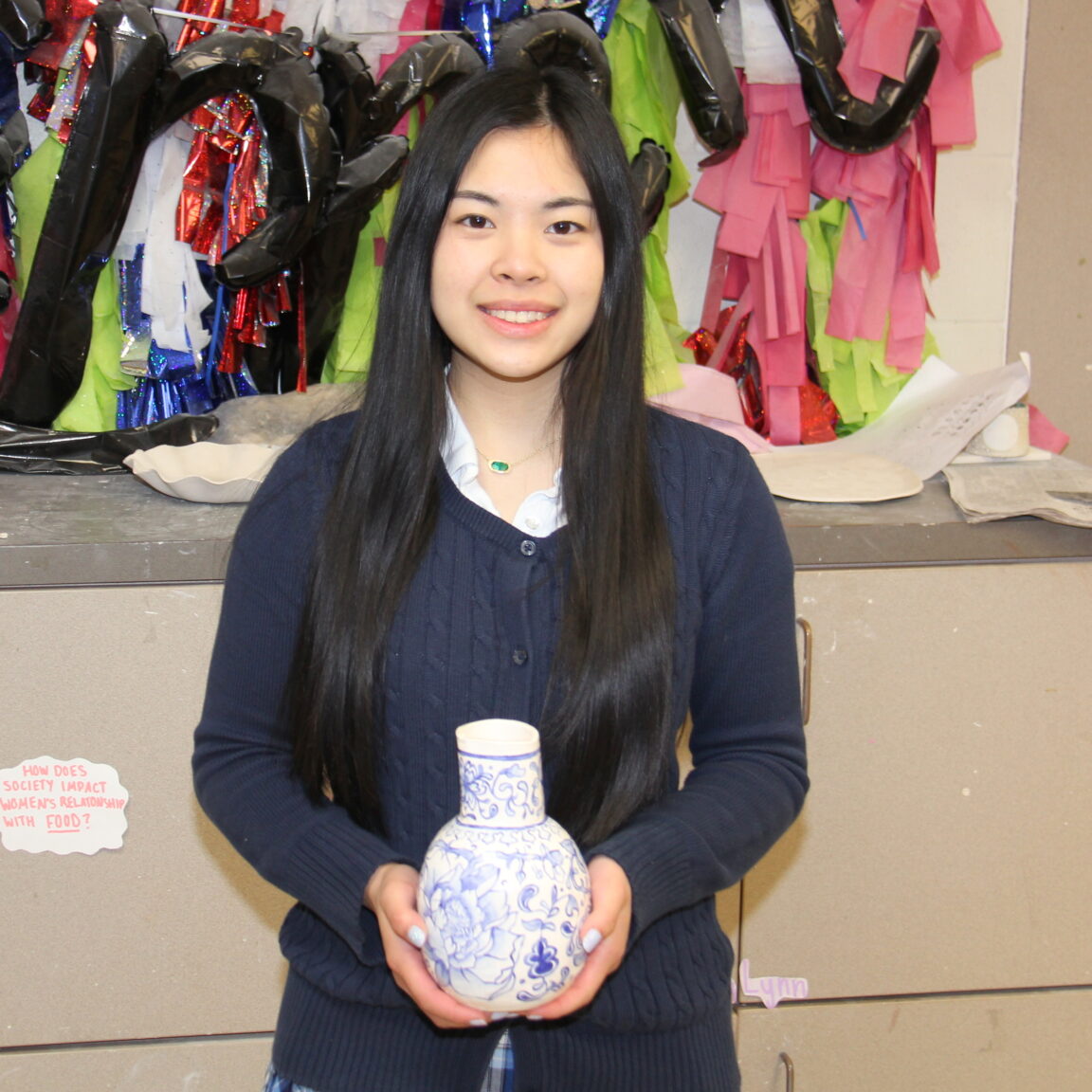 Liz Singkhonket with her award winning ceramics piece