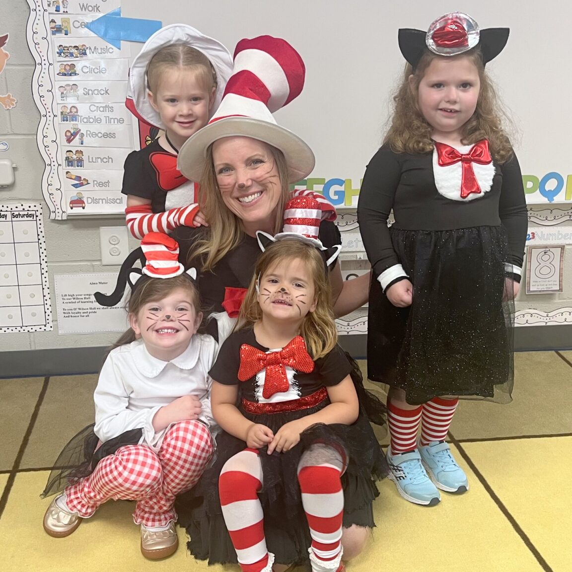a teacher with young students wearing Dr. Suess outfits